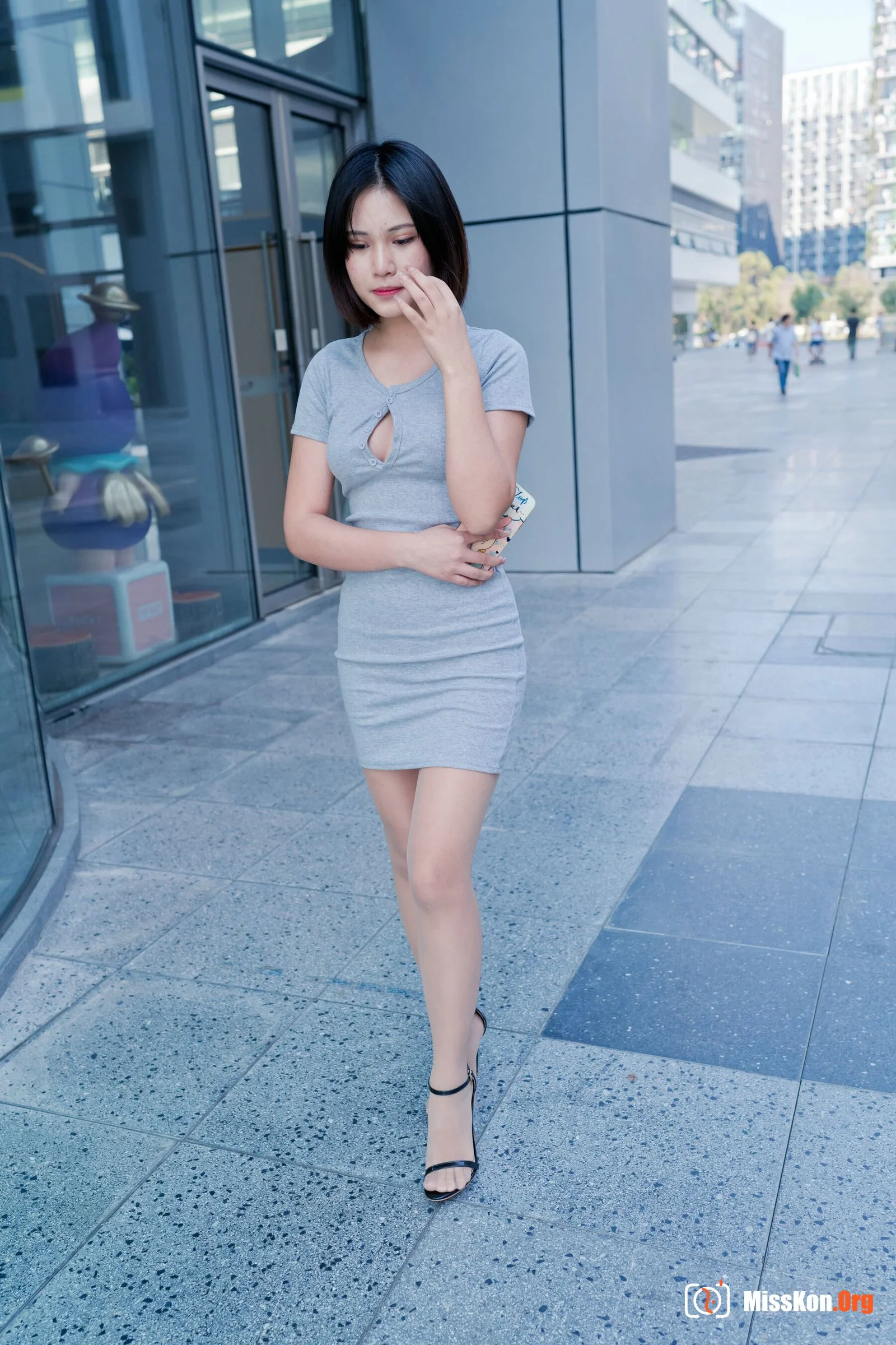 A cute baby in a bodycon skirt and stockings looking at the funhouse mirrors in the shopping plaza. (Magic Mirror Street Photography) - Photo 10