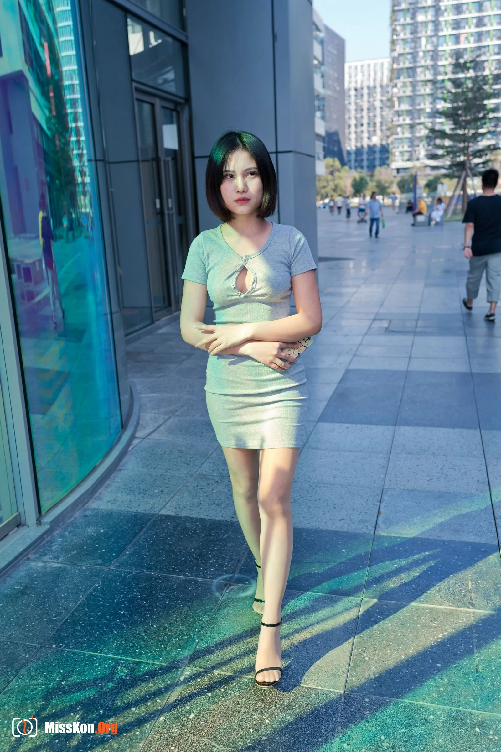 A cute baby in a bodycon skirt and stockings looking at the funhouse mirrors in the shopping plaza. (Magic Mirror Street Photography) - Photo 11
