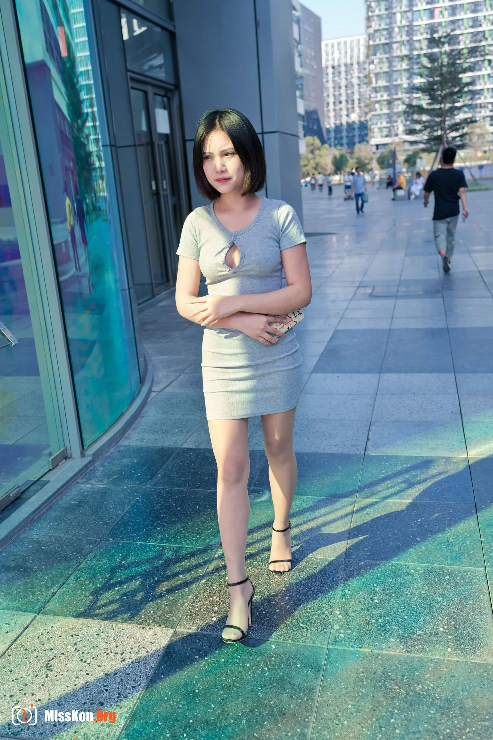 A cute baby in a bodycon skirt and stockings looking at the funhouse mirrors in the shopping plaza. (Magic Mirror Street Photography) - Photo 12
