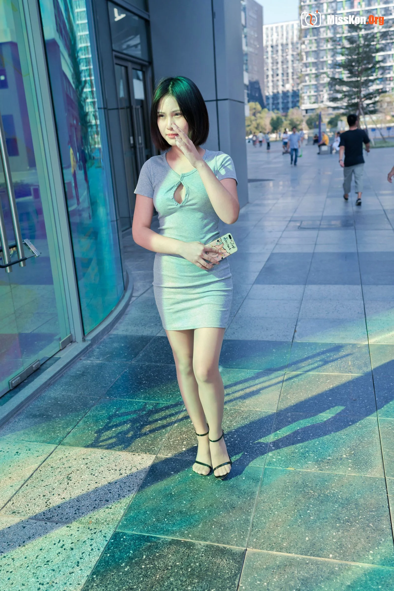 A cute baby in a bodycon skirt and stockings looking at the funhouse mirrors in the shopping plaza. (Magic Mirror Street Photography) - Photo 13