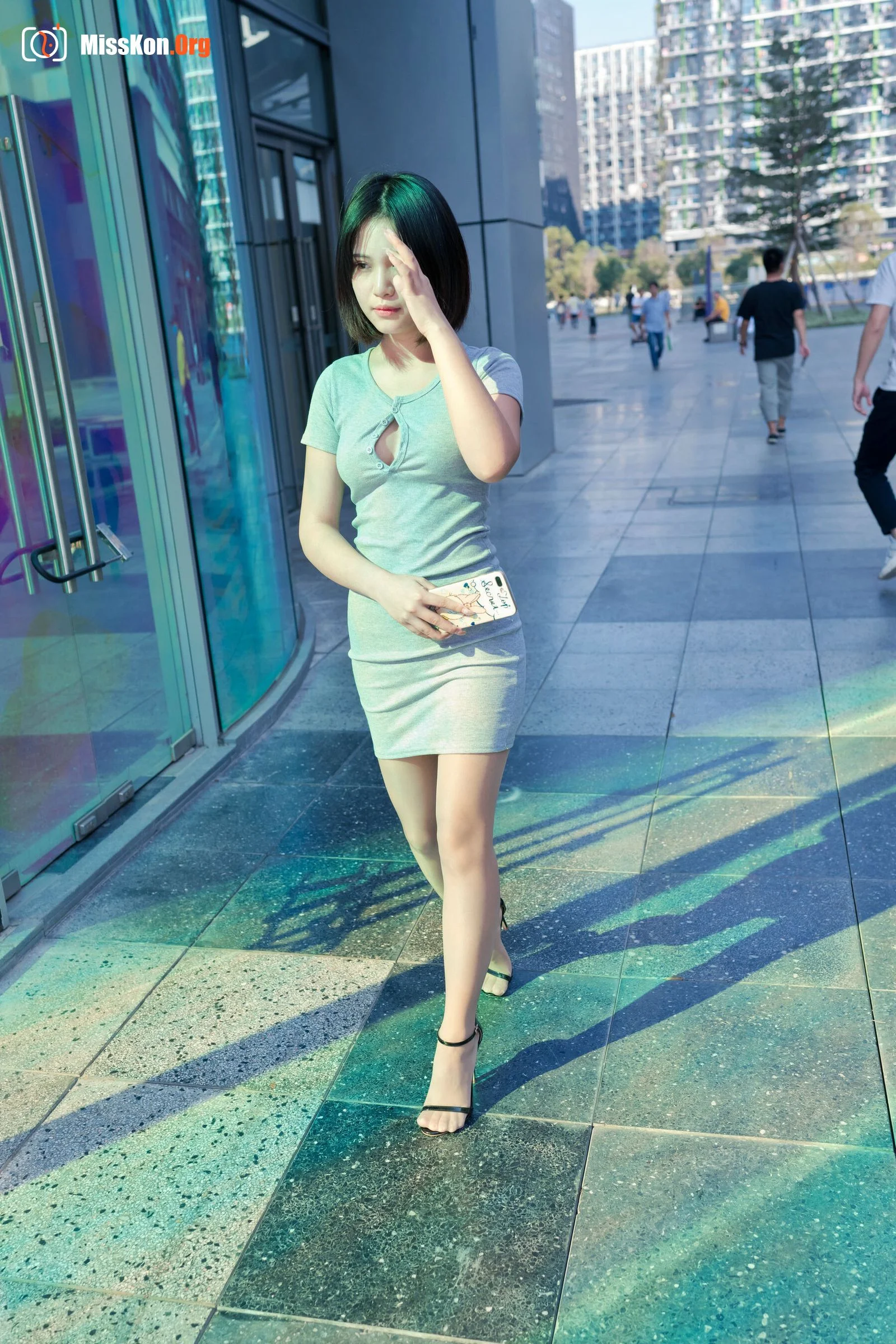 A cute baby in a bodycon skirt and stockings looking at the funhouse mirrors in the shopping plaza. (Magic Mirror Street Photography) - Photo 14