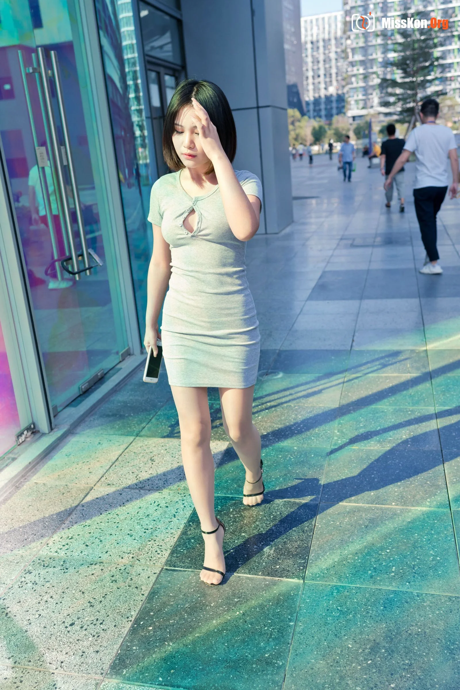 A cute baby in a bodycon skirt and stockings looking at the funhouse mirrors in the shopping plaza. (Magic Mirror Street Photography) - Photo 15