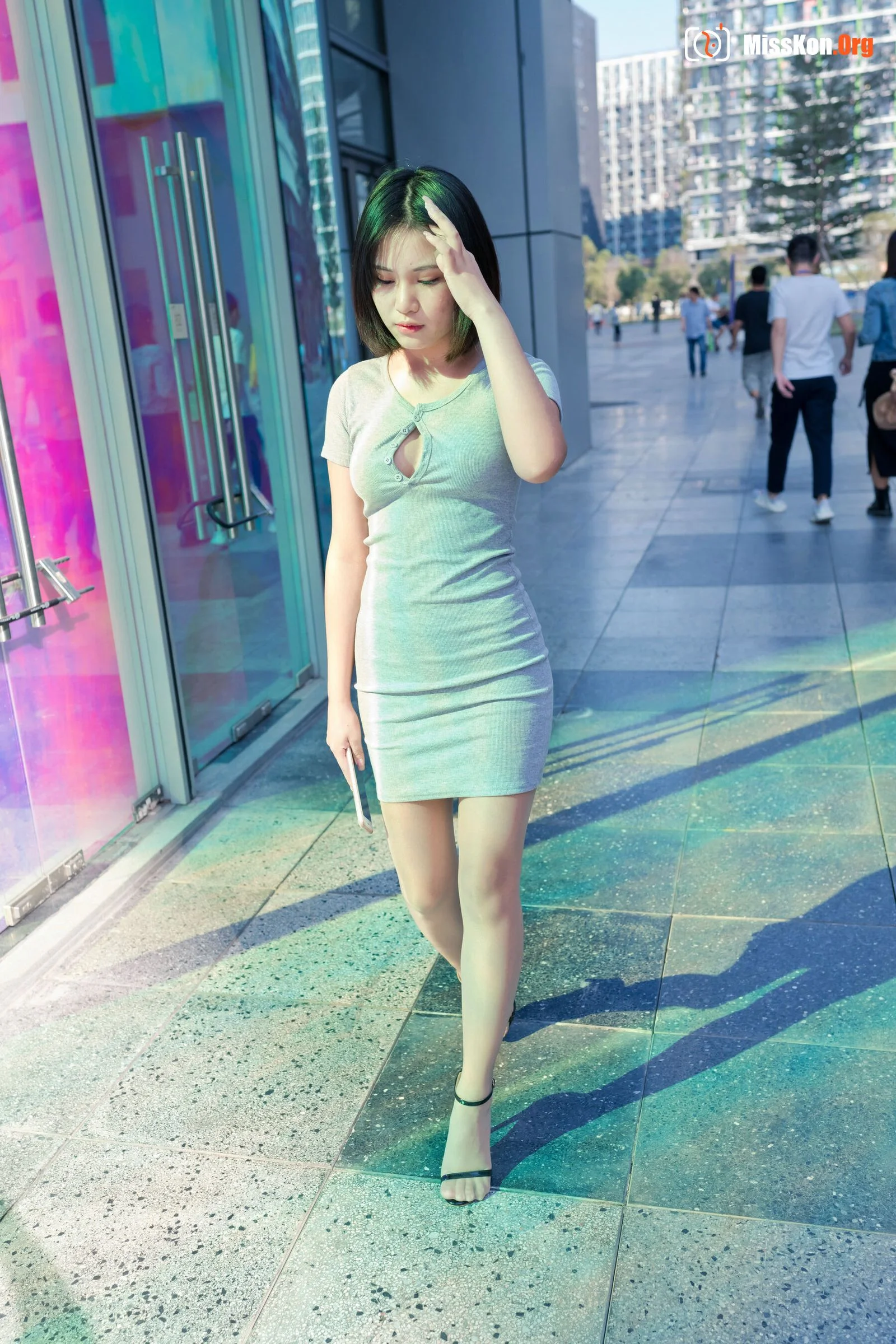 A cute baby in a bodycon skirt and stockings looking at the funhouse mirrors in the shopping plaza. (Magic Mirror Street Photography) - Photo 17