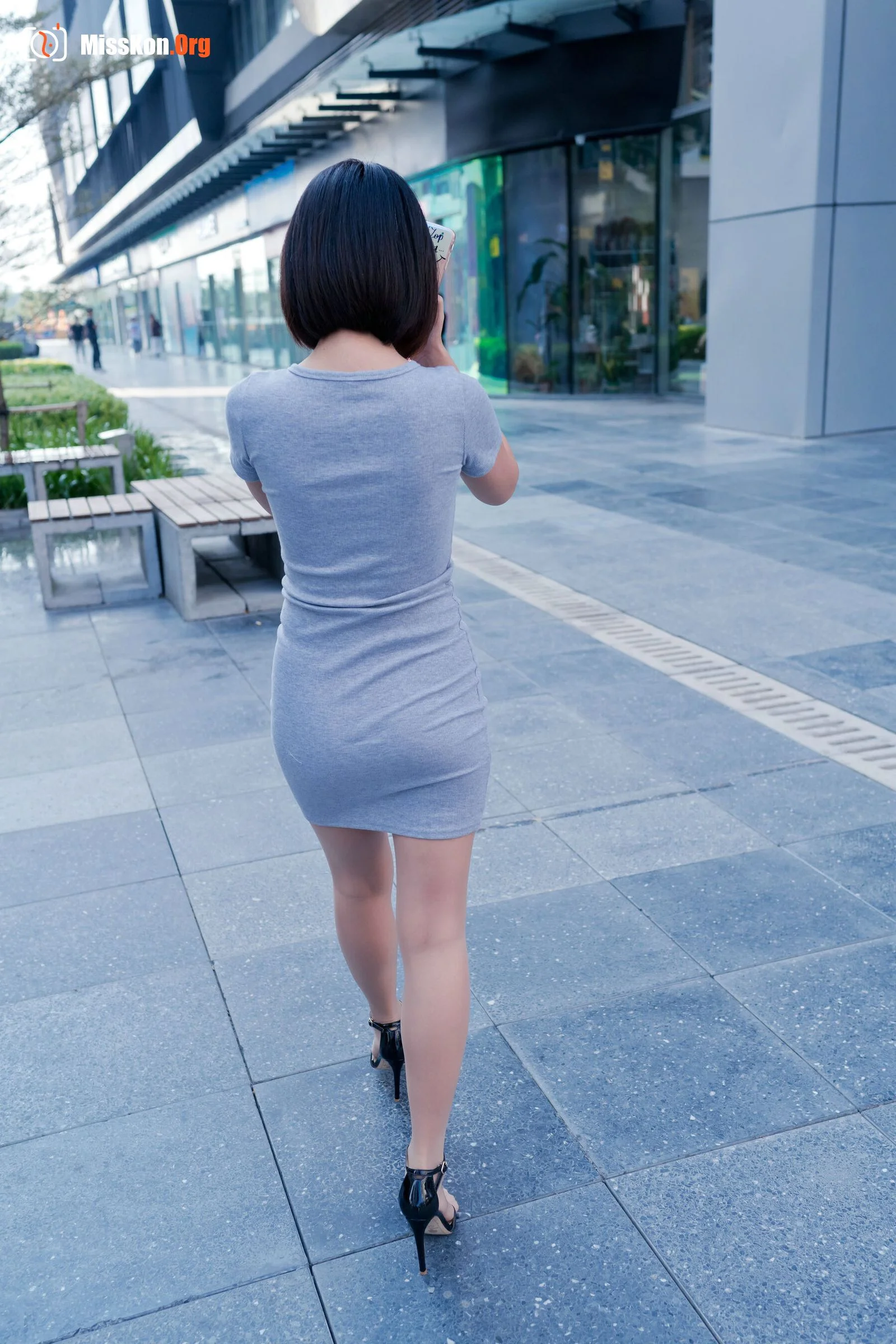 A cute baby in a bodycon skirt and stockings looking at the funhouse mirrors in the shopping plaza. (Magic Mirror Street Photography) - Photo 2