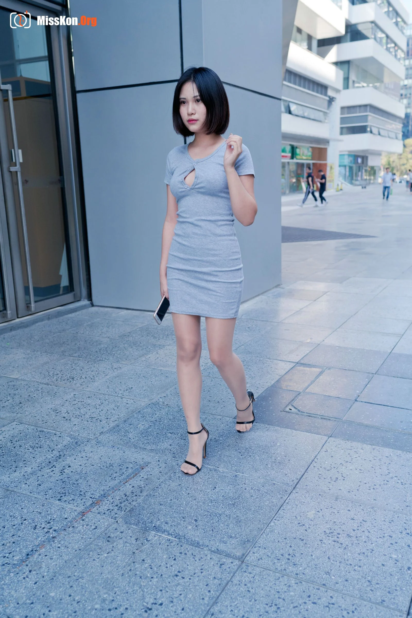 A cute baby in a bodycon skirt and stockings looking at the funhouse mirrors in the shopping plaza. (Magic Mirror Street Photography) - Photo 4