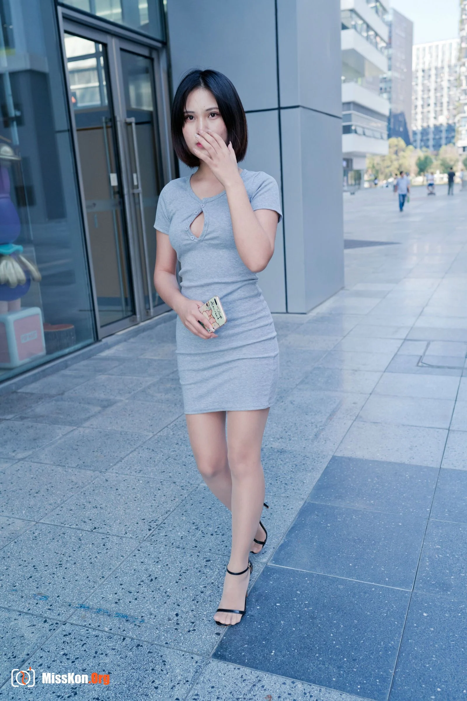 A cute baby in a bodycon skirt and stockings looking at the funhouse mirrors in the shopping plaza. (Magic Mirror Street Photography) - Photo 9