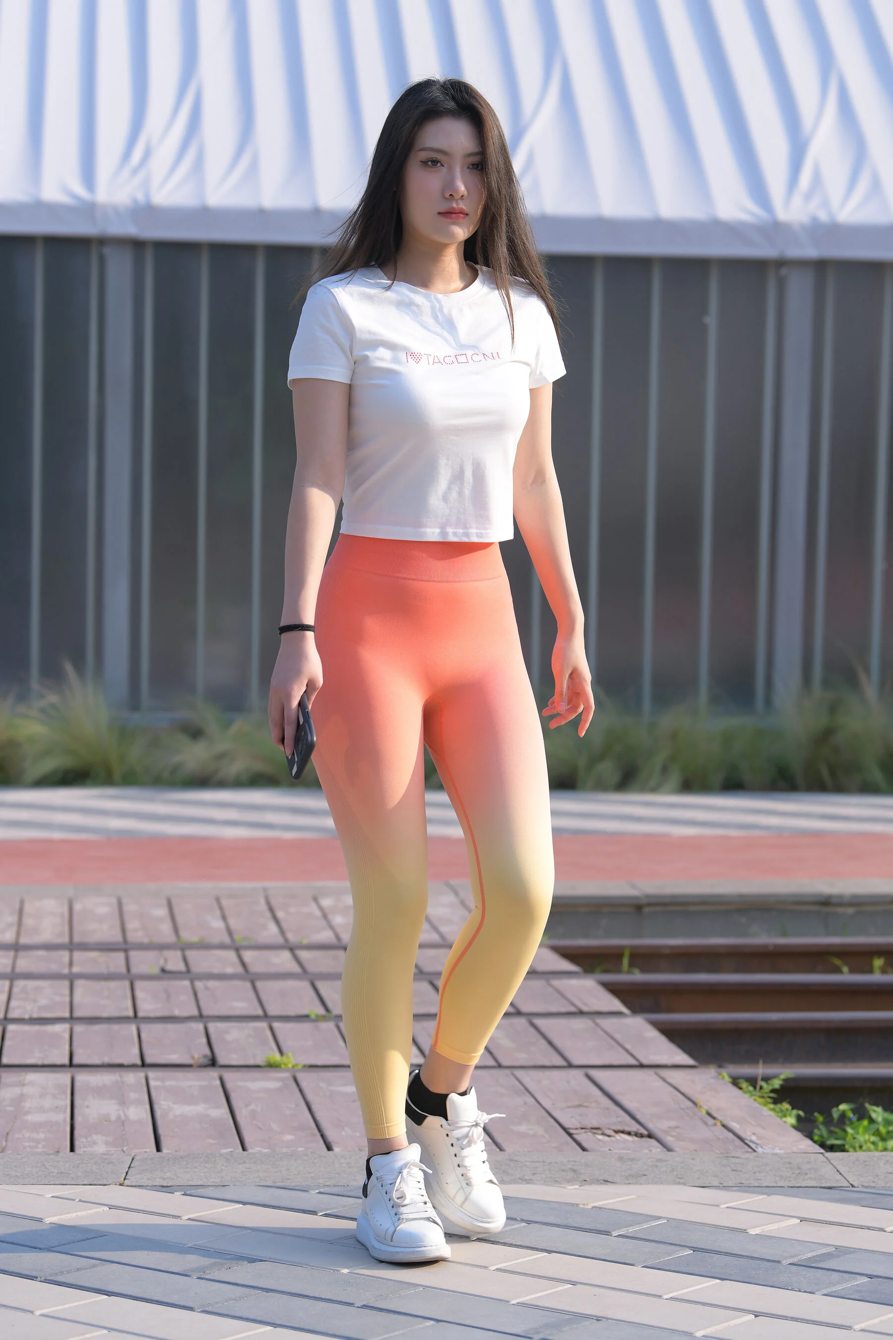 Beautiful girl in red yoga pants (Magic Mirror Street Photography: A moose)