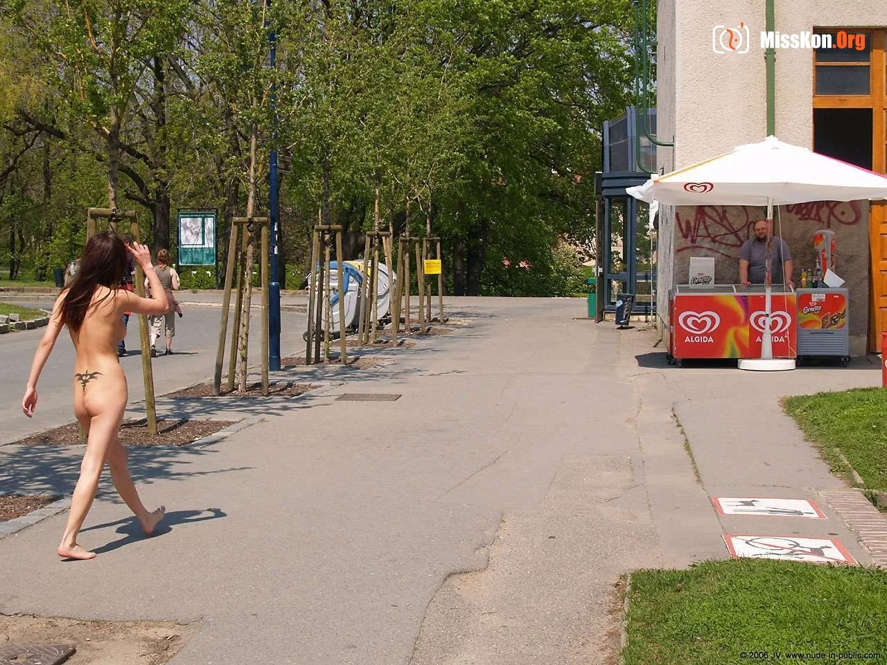 Mongolian model Agnes walks naked through a city park - Photo 12