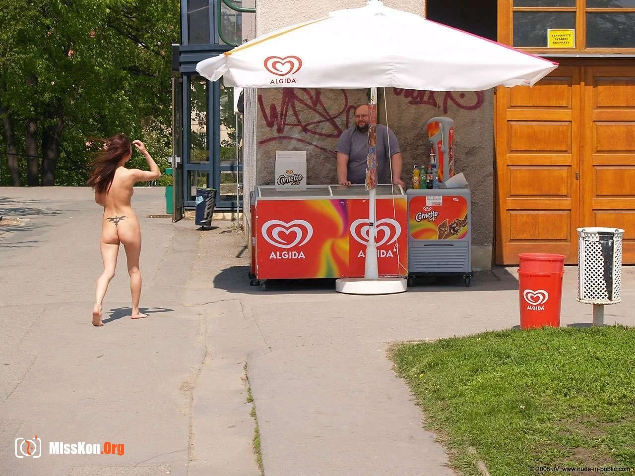 Mongolian model Agnes walks naked through a city park - Photo 14