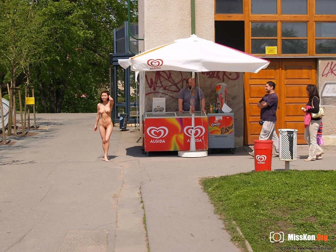 Mongolian model Agnes walks naked through a city park - Photo 16