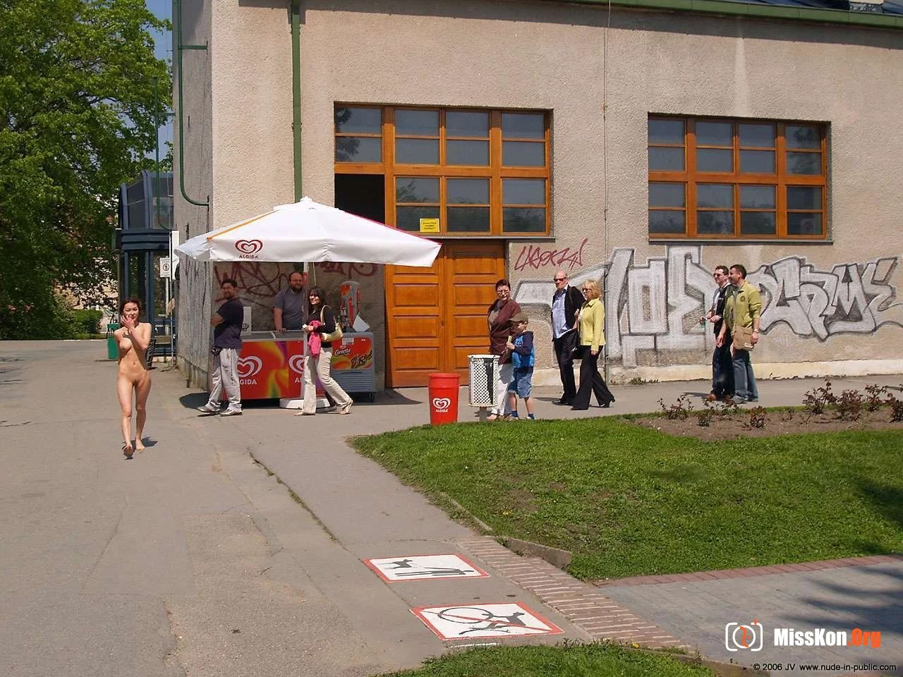 Mongolian model Agnes walks naked through a city park - Photo 17