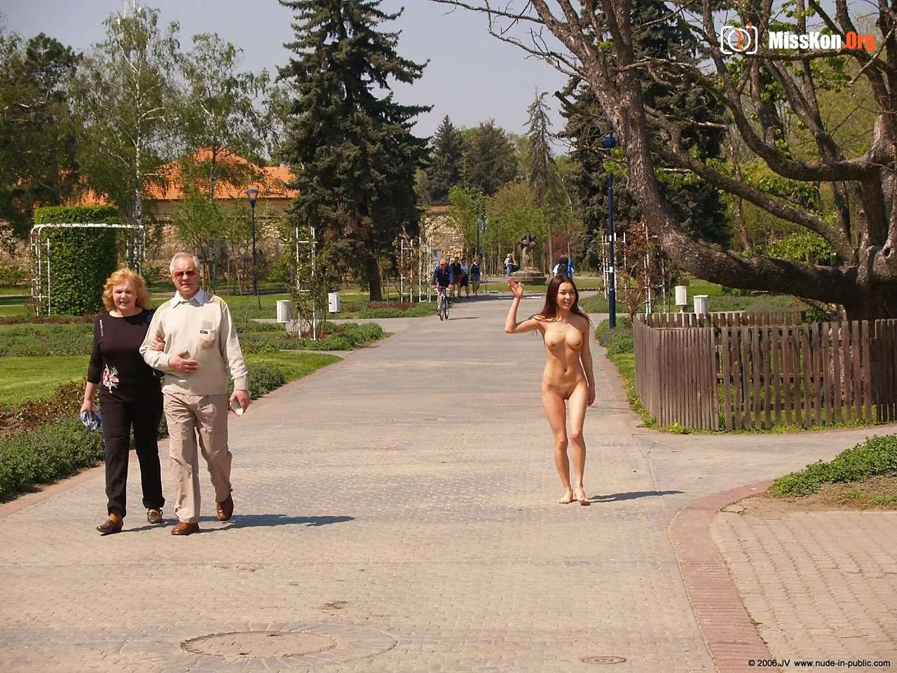 Mongolian model Agnes walks naked through a city park - Photo 6
